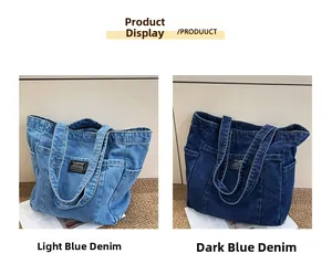 Detail view of denim tote bags in light and dark blue with side pockets and fabric label