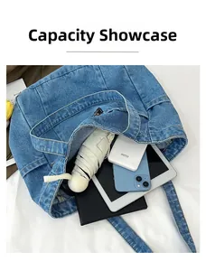 Top view showing the spacious interior of the blue denim tote bag with daily essentials