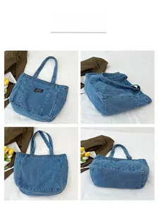 Detail view of denim canvas tote bag featuring multiple pockets and durable shoulder strap