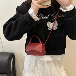Red crocodile pattern mini crossbody bag with top handle and adjustable shoulder strap