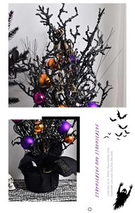 Detail of a black Halloween glitter tree with purple ornaments and skull on a burlap base