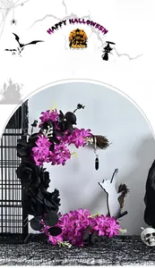 Detail of moon-shaped Halloween wreath with black roses, purple flowers, and cat silhouette