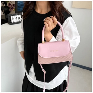 Pink shoulder bag featuring contrast textures with fashion gold handle and strap detail