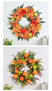 Detailed view of autumn harvest wreaths featuring faux pumpkins and vibrant silk flowers