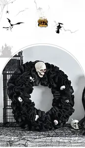 Close-up of Halloween wreath featuring black mesh fabric and multiple white skulls decor