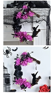 Detail of Halloween crescent moon wreath with black roses, purple flowers and a cat silhouette