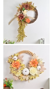 Detail of autumn harvest wreaths featuring artificial pumpkins, maple leaves and roses