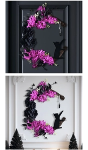 Macro detail of crescent moon wreath with black roses, cat silhouette and crystal pendant