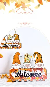 Detailed view of three festive autumn gnomes holding a Welcome sign with maple leaves