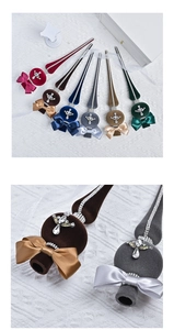 Detailed view of flocked Christmas tree star decorations with rhinestones and ribbon bows