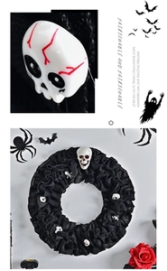 Detail of Halloween skull wreath featuring black mesh fabric and creepy white skull accents