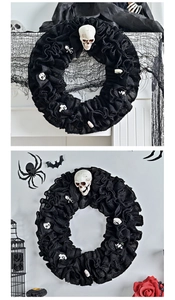 Close-up of Halloween black burlap wreath featuring small white skull decorations