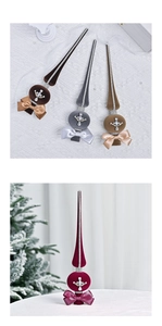 Detail of velvet Christmas tree topper with rhinestones and ribbon in festive setting