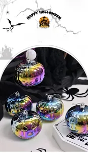 Macro view of iridescent pumpkin ornaments with spooky faces and silver hanging cords