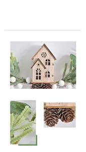 Detail of wooden house ornament with pine needles and cones for Christmas decor