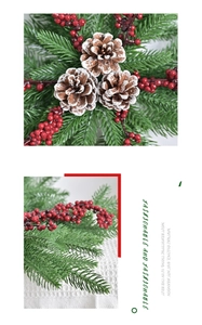 Detail of Christmas pine needles with snowy pine cones and vibrant red berries