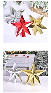 Close-up of gold, red and silver Christmas tree toppers with metallic finish for tree decoration