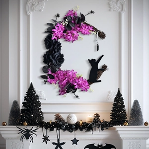 Halloween crescent moon wreath with black roses and cat silhouette on a white wall decor