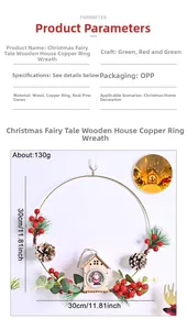 Detail of Christmas wreath with red berries, pine cones and a small wooden house