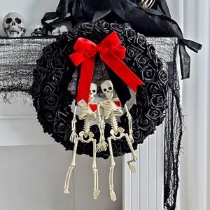 Gothic Halloween wreath with black roses, red satin bow and skeleton models decor