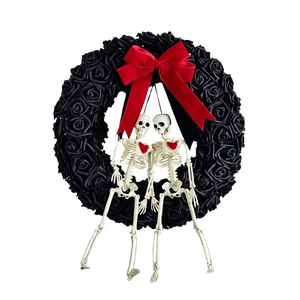 Gothic Halloween wreath featuring black roses, red bow, and skeleton couple with red hearts