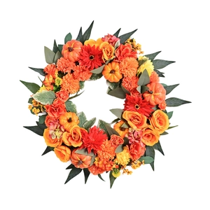 Autumn harvest pumpkin wreath with orange roses and dahlias for Thanksgiving decor