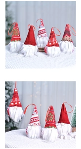 Detail view of 5-piece Christmas gnome ornaments with knitted hats and white beards