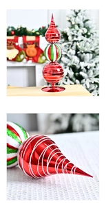 Macro shot of tiered Christmas ball ornament with glitter swirls and metal base