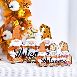 Set of autumn gnomes with maple leaf patterns and Welcome wooden sign for Thanksgiving decor