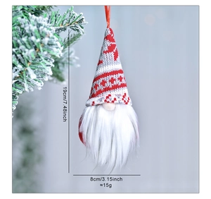 Detail view of a 19cm plush Christmas gnome ornament with red snowflake knitted hat