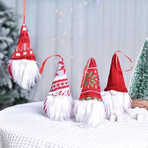 Set of four Christmas gnome ornaments with knitted hats and plush beards for holiday trees