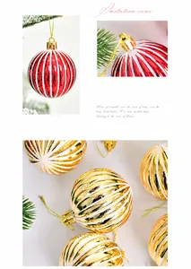 Detail of red and gold Christmas balls with textured white stripes and hanging loops