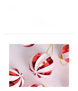 Detail view of red and white striped Christmas ball with glitter and wave texture