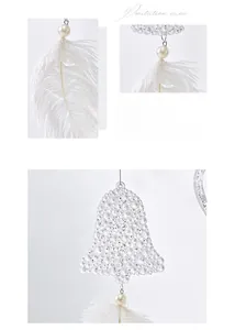 Macro shot of white feathers and clear beaded bell ornament for Christmas decor