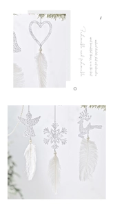 Glittery white Christmas ornaments with heart, angel, snowflake and feather tassel