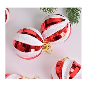 Macro detail of red and white spiral glitter Christmas ball ornaments with gold string