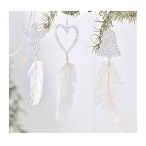 Detailed view of angel and heart ornaments with white feathers on a Christmas tree