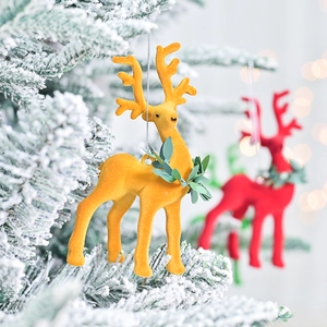 Flocked reindeer Christmas tree ornaments in red and yellow with festive green leaf detail