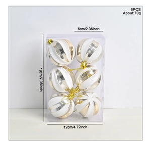 Detail view of 6cm white and gold Christmas balls with size dimensions and packaging