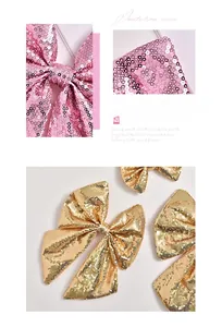 Close-up of sparkling pink and gold sequin bow pendants for festive Christmas decorations