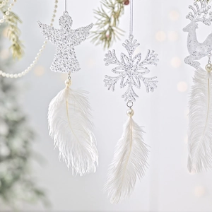Sparkling white Christmas tree ornaments with feathers, angel, snowflake, and elk shapes