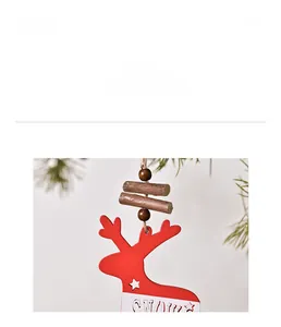 Detail of wooden reindeer ornament with SNOW text and hollow stars for Christmas tree