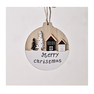 Detail of wooden Christmas ornament with 3D layered house and Merry Christmas text