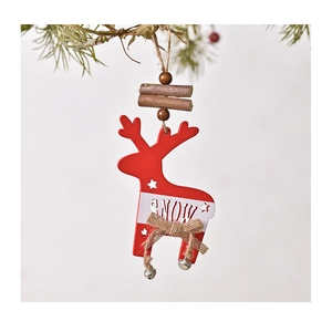 Macro detail of red and white wooden reindeer ornament with bells and SNOW engraving