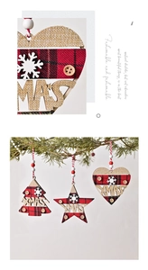 Detail of Xmas wooden ornaments with red plaid fabric and festive star heart shapes