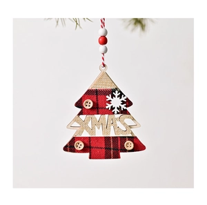 Detail of wooden Christmas tree ornament with red black plaid fabric and XMAS text