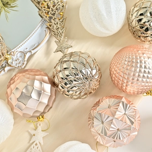 Elegant Christmas ball ornaments set with geometric textures and glitter in rose gold and silver