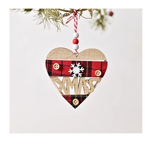 Detail of heart-shaped wooden XMAS ornament with red black plaid and button accents