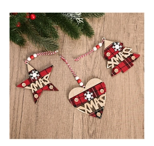 Detailed close-up of wooden Xmas ornaments with red plaid fabric and snowflake accents