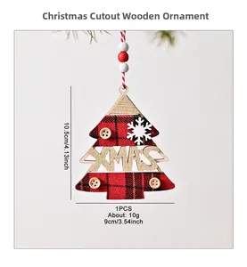 Detail view of wooden Christmas tree ornament with red plaid fabric and XMAS cutout